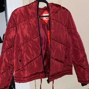This a burgundy puffer jacket
